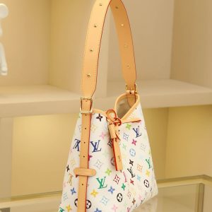 Alternative view of 2025 Takashi Murakami Collaboration CarryAll Small Handbag Crafted from thirty-three-color canvas with leather trim, this compact companion is perfect for urban living. Its generous silhouette features a neatly organized interior, enhanced by a large inner pocket for added functionality. A detachable thirty-three-color canvas zippered pouch is secured with a leather strap. Dimensions: 24*29*12cm